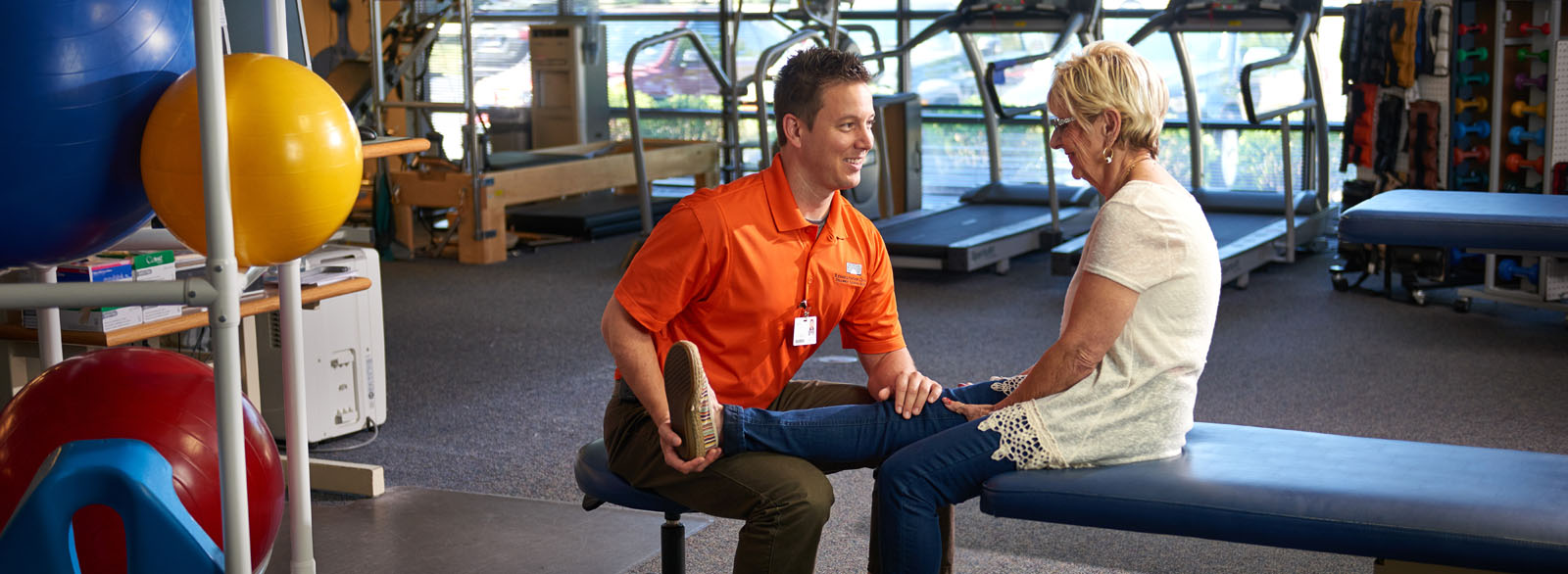 Physical therapist working with a patient in an outpatient setting.