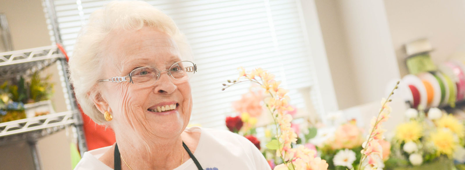 Woman arranging flowers.