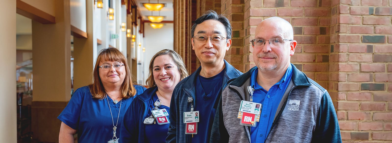 Group of four nurses in the South Gallery at Columbus Regional Hospital.