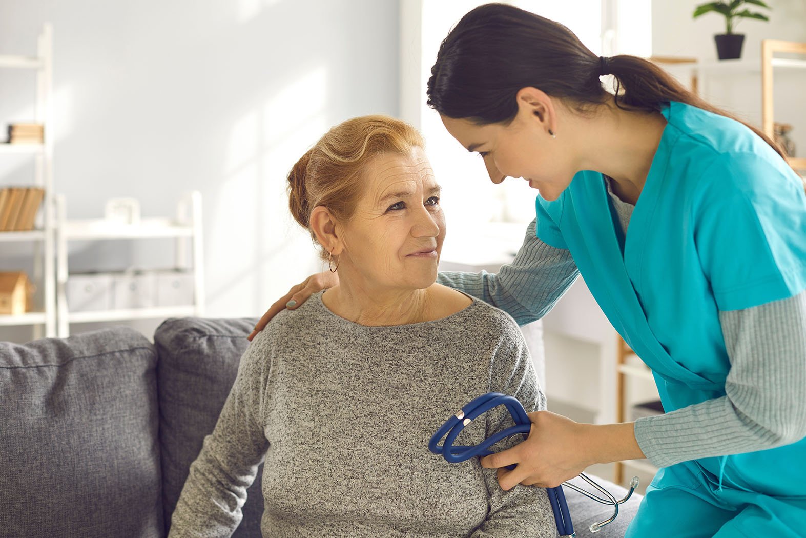 Patient and nurse looking at each other.